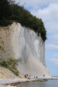 Scenic view of waterfall against sky