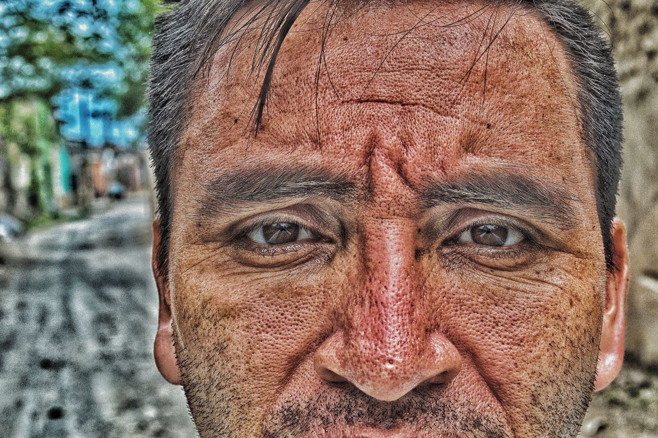 CLOSE-UP PORTRAIT OF MAN WEARING MASK