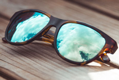 Reflection of sunglasses on table