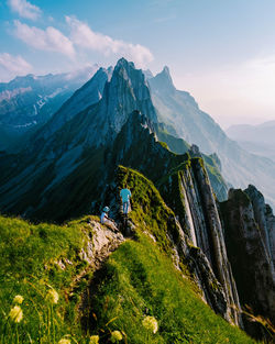 Scenic view of mountain against cloudy sky