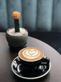 Close-up of coffee cup on table