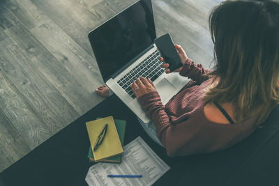 Woman working on laptop at home. female hands typing on pc keyboard. girl studying online