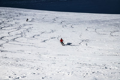 High angle view of person on snow covered land