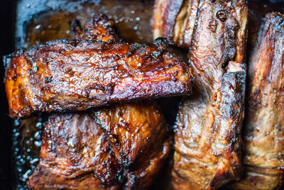 High angle view of meat on barbecue grill