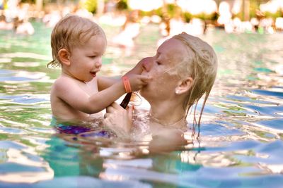 Portrait of boy swimming in pool