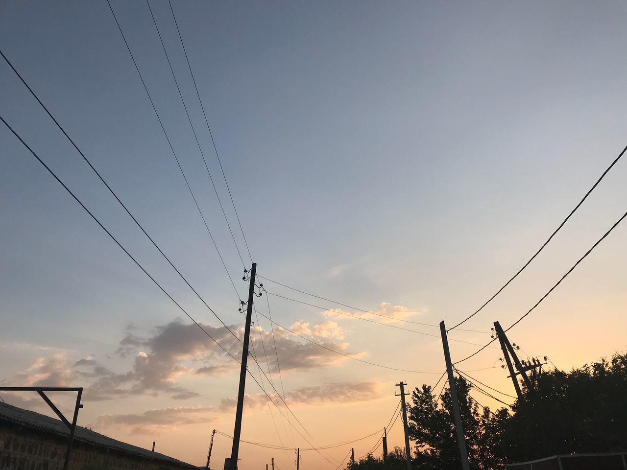 sky, cable, electricity, power line, sunset, technology, cloud - sky, connection, power supply, silhouette, electricity pylon, fuel and power generation, low angle view, nature, no people, beauty in nature, tree, plant, tranquil scene, tranquility, outdoors, telephone line, complexity