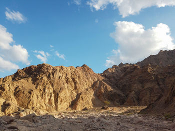 Panoramic view of rocky mountains against sky