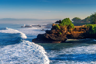 Scenic view of sea waves against sky