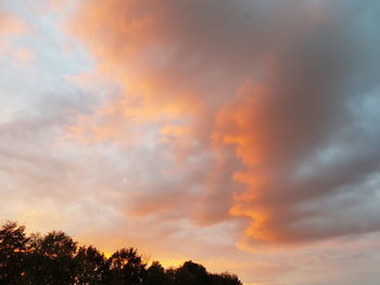 Low angle view of dramatic sky during sunset