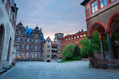 Buildings in town against sky