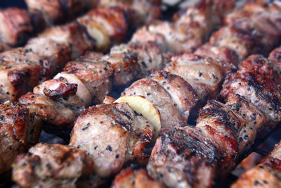 Full frame shot of meat on barbecue grill