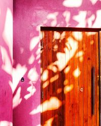 Close-up of shadow on pink curtain