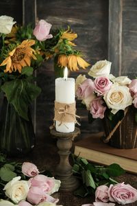 Close-up of illuminated candles on table