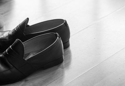 High angle view of shoes on hardwood floor