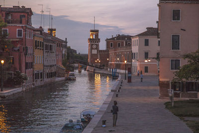 Canal passing through city buildings