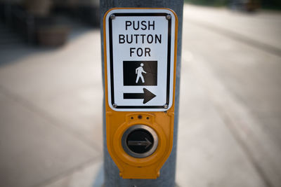 Close-up of pedestrian sign on street