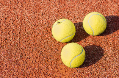 Directly above shot of tennis balls on court