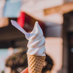 Close-up of hand holding ice cream cone