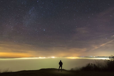 Full length of man against sky at night