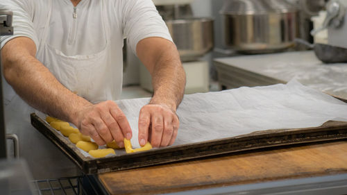 Midsection of man working in workshop