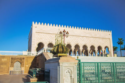 Low angle view of historical building against blue sky