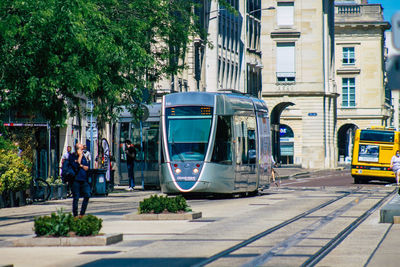 People waiting on train in city