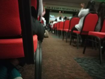 Rear view of people sitting on chair