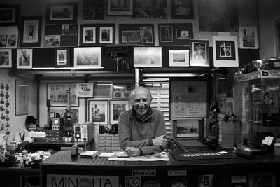 Portrait of man sitting in store