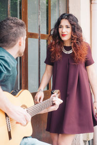 Young woman playing guitar