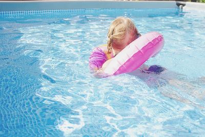 Boy swimming in pool