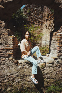 Portrait of woman sitting outdoors