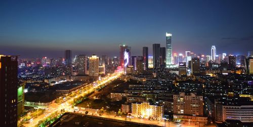 Illuminated cityscape at night