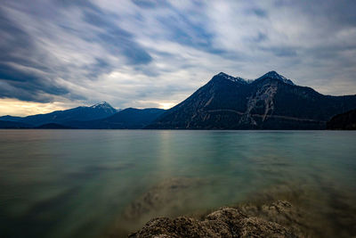 Scenic view of lake and mountains against sky