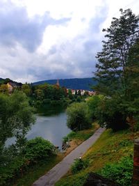 High angle view of river amidst trees against sky