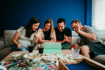 Group of people sitting at home