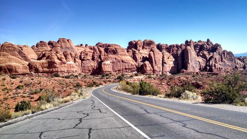 Empty road passing through mountain