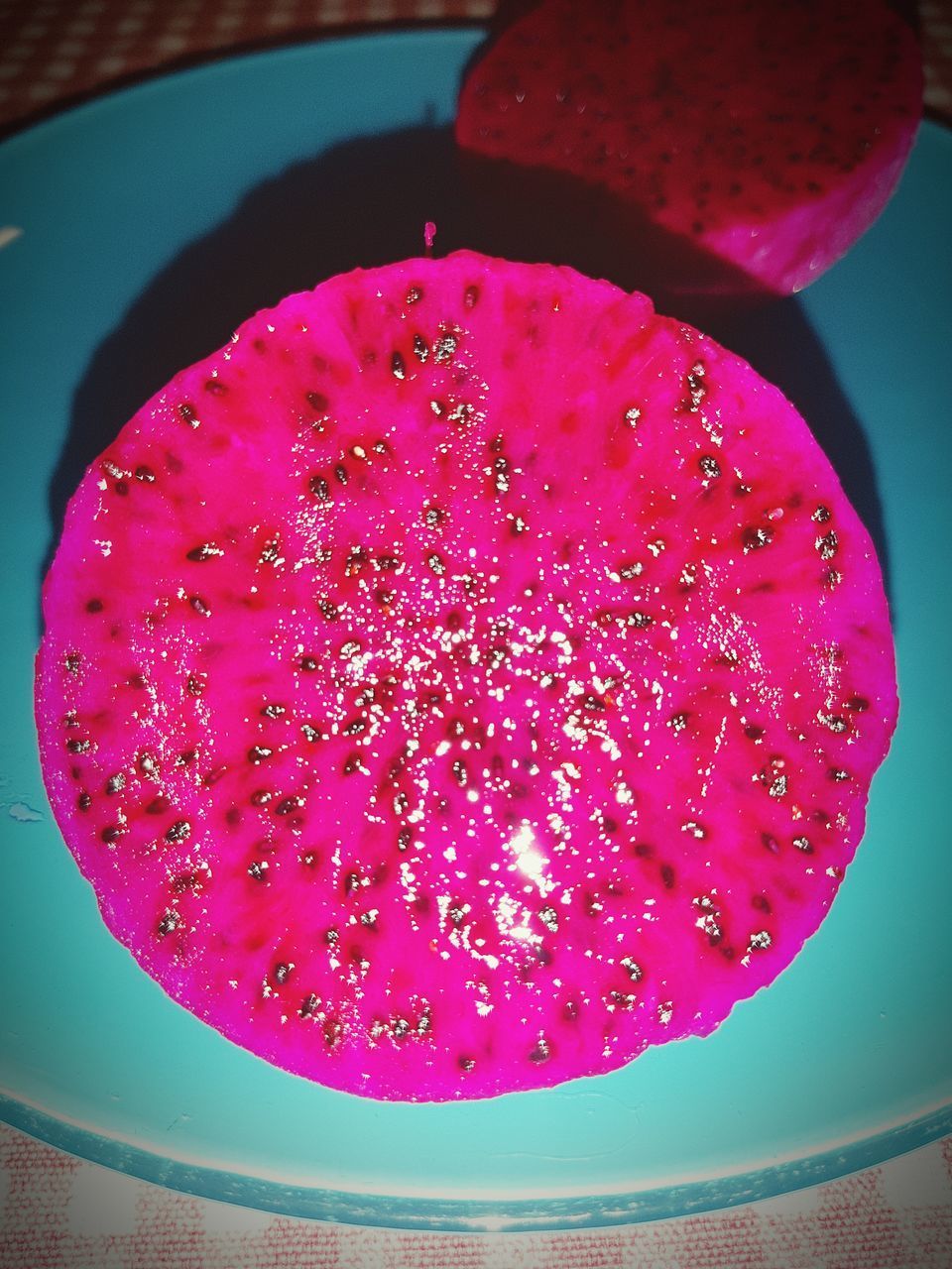 HIGH ANGLE VIEW OF PINK FRUITS IN BOWL