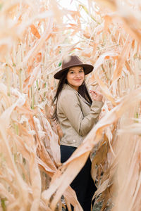 Portrait of smiling young woman standing outdoors