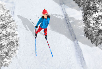 High angle view of woman skiing on field