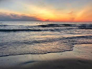 Scenic view of sea against sky during sunset