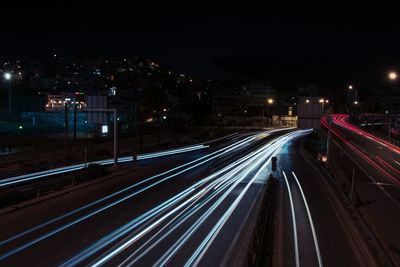 High angle view of light trails on road at night