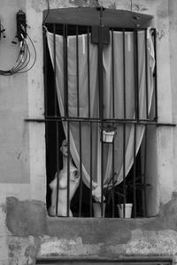 Clothes hanging on wall of building