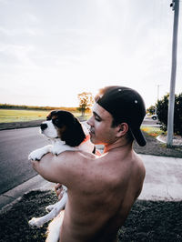 Side view of man with dog 