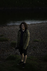 Portrait of smiling teenage boys standing on field