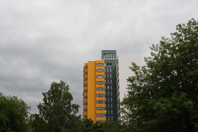 Low angle view of sign board against sky