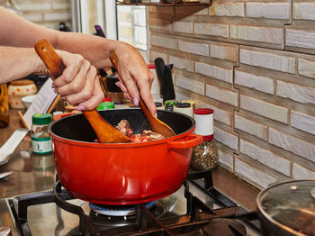 Cropped hand of person preparing food