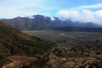 Scenic view of landscape and mountains against sky