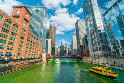 Unrecognizable people and tourist on the yacht running over the chicago river walk 