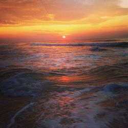 Scenic view of sea at sunset