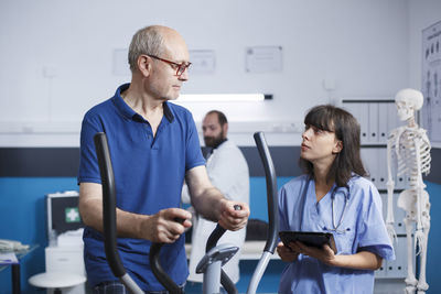 Side view of doctor working at clinic